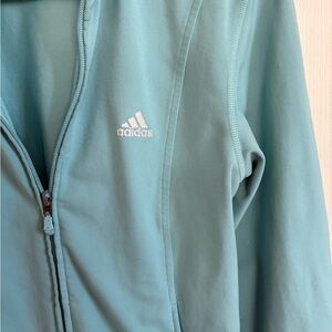 Adidas Women’s Teal Zip-Up Hoodie with reflective logo and interior pockets